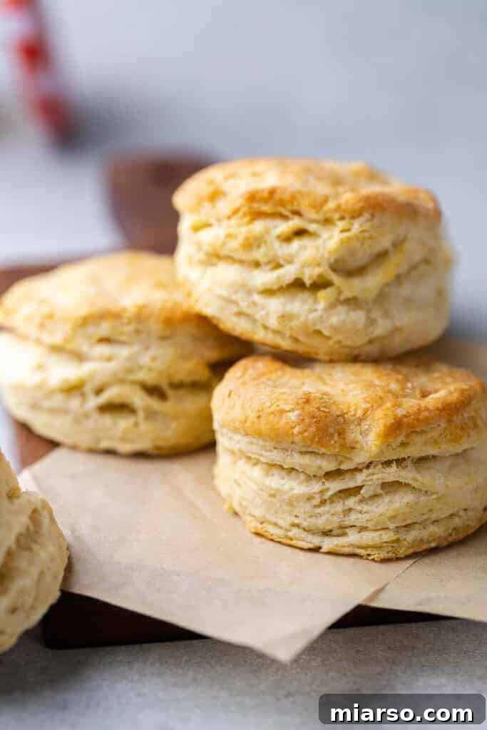 A fresh batch of golden, flaky small-batch biscuits cooling on a rack, perfect for two.