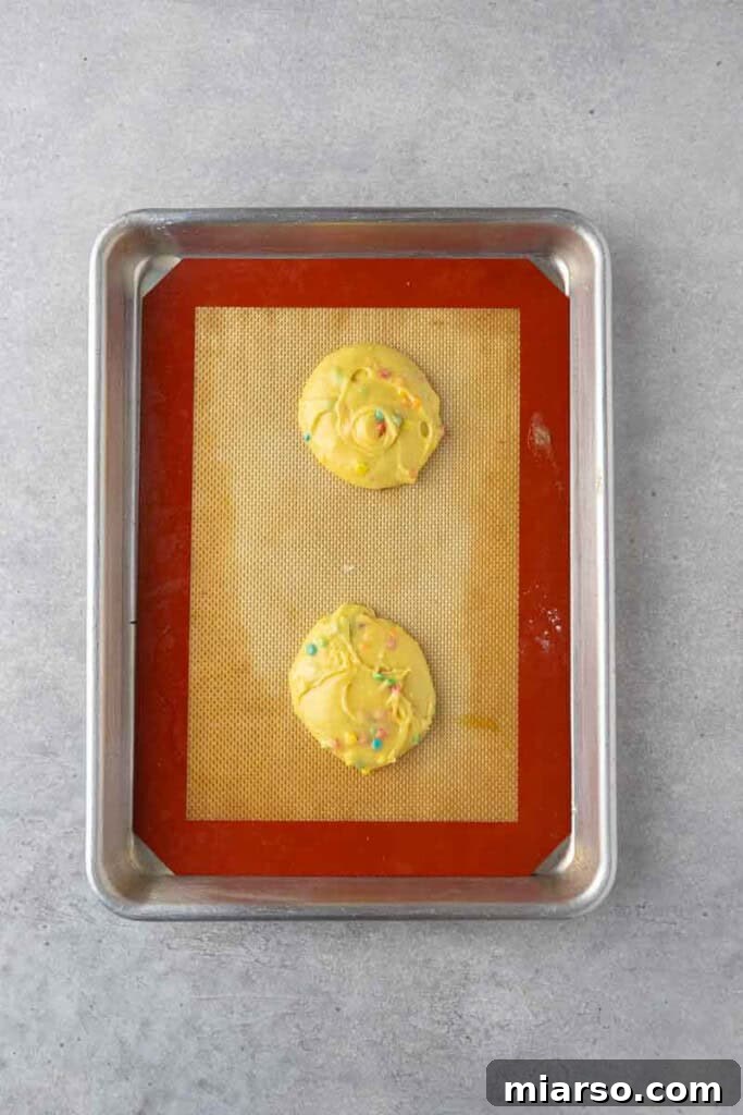 Raw cookie dough on baking sheet