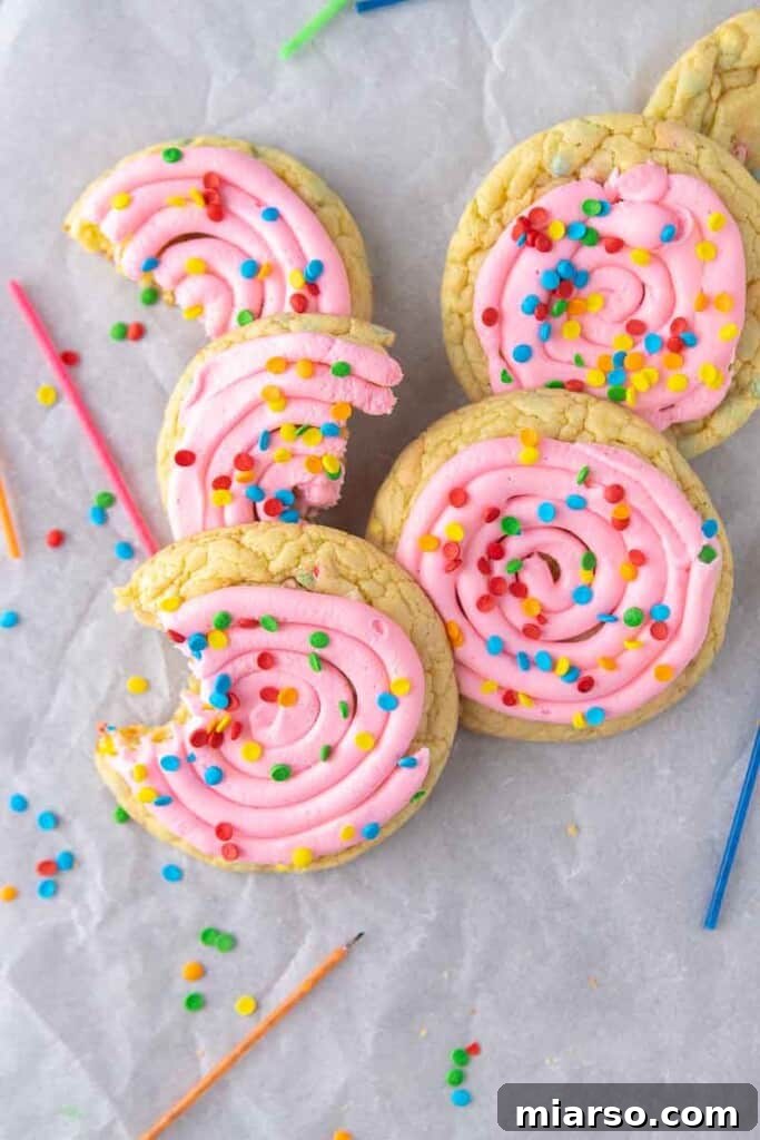 Bunch of confetti cake cookies next to candles