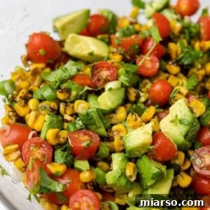 Close up of summer roasted corn salad with avocados