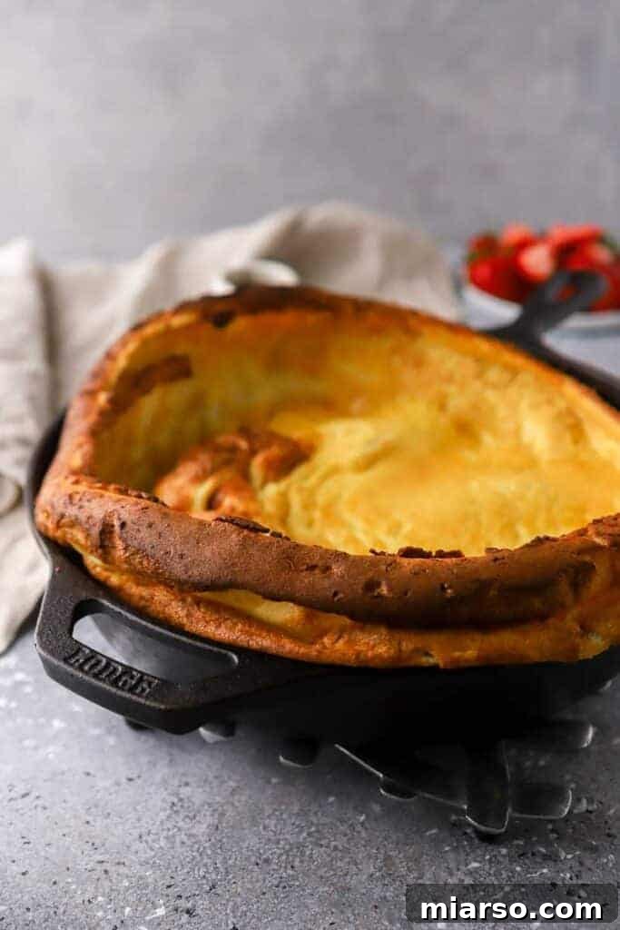 Puffed up skillet pancake with golden brown edges