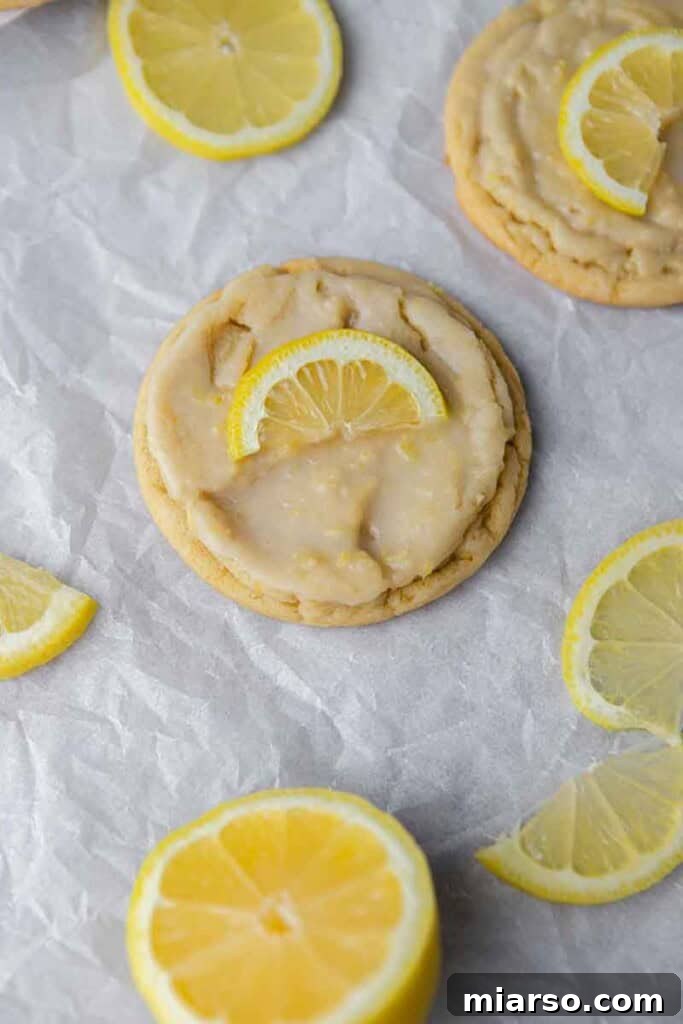 Effortless Crumbl Lemon Glazed Cookies 3 Overhead shot of multiple vibrant CRUMBL lemon glaze cookies arranged beautifully.
