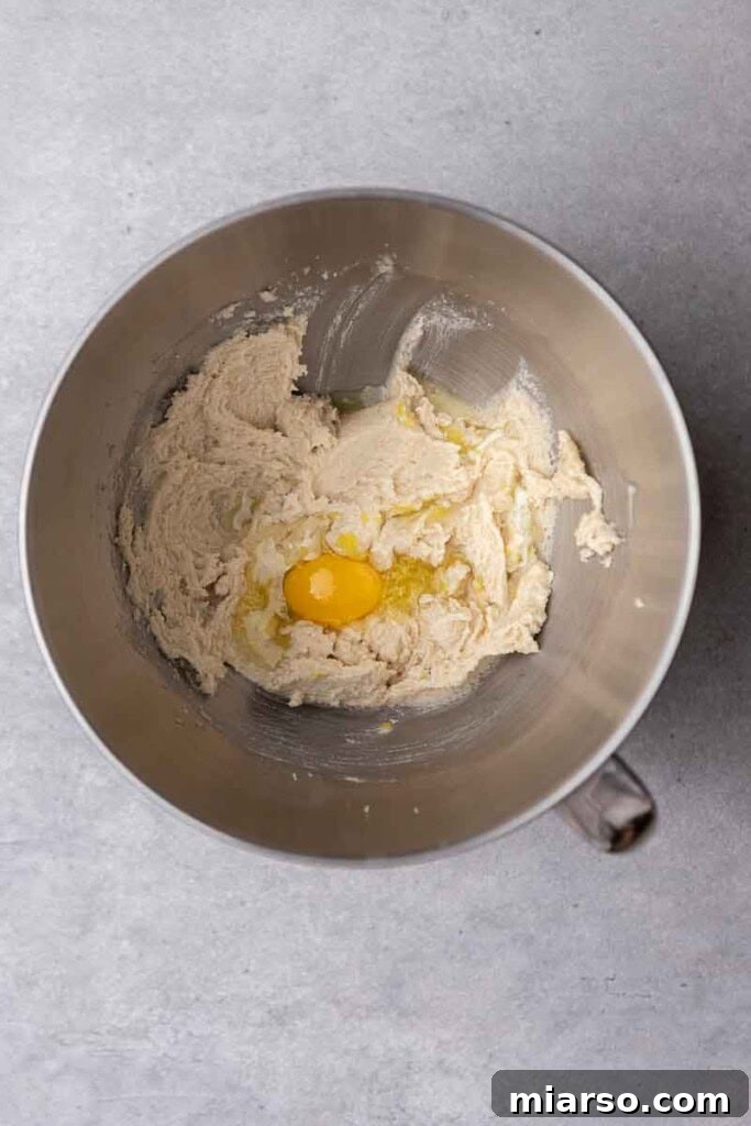 Effortless Crumbl Lemon Glazed Cookies 5 Butter, egg, and lemon juice creaming in a stand mixer.