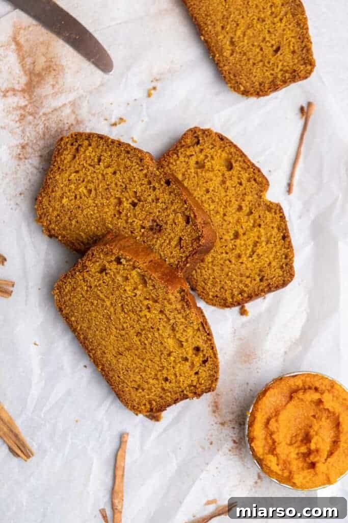 Slices of moist fall quick bread with pumpkin