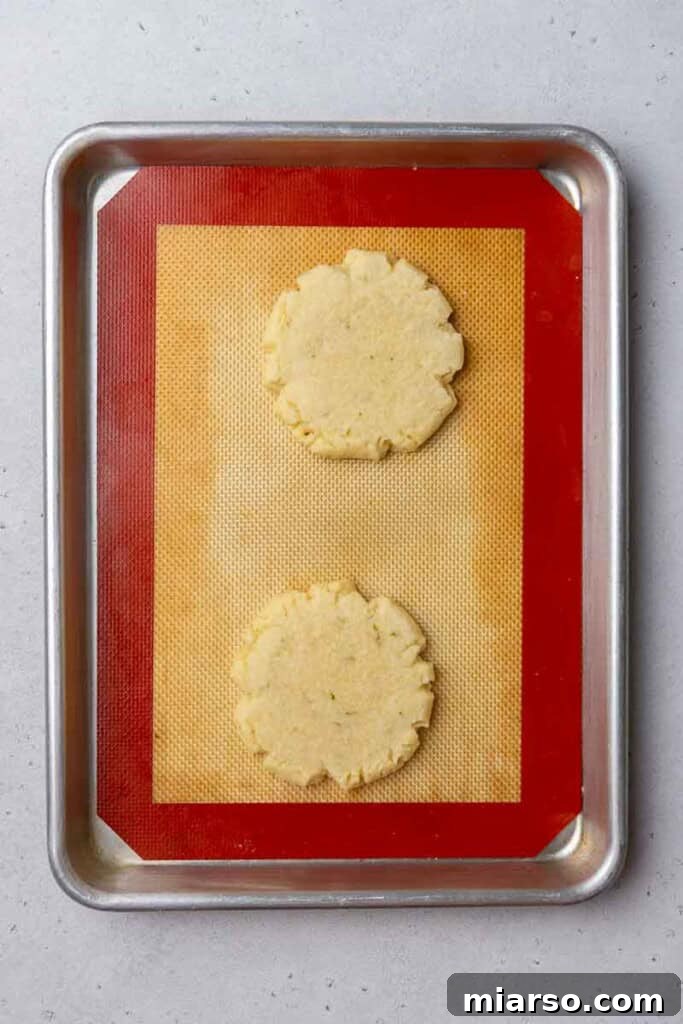 Freshly baked cookies on a baking sheet, cooling down