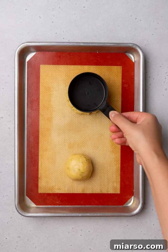 Preparing to bake cookie dough balls