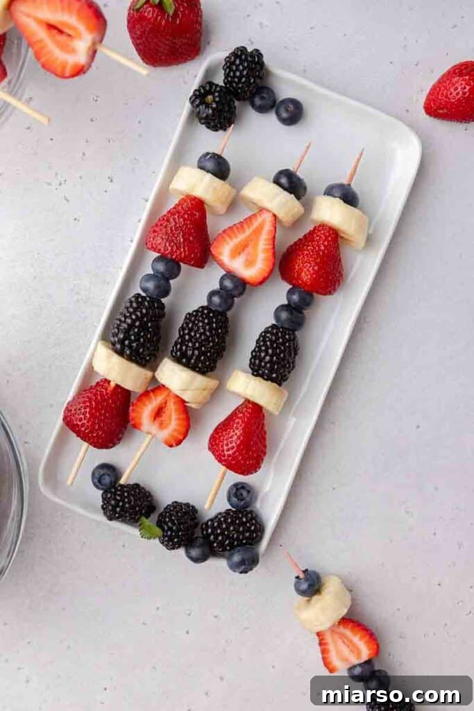 Kid-Friendly Red White and Blue Fruit Skewers presented