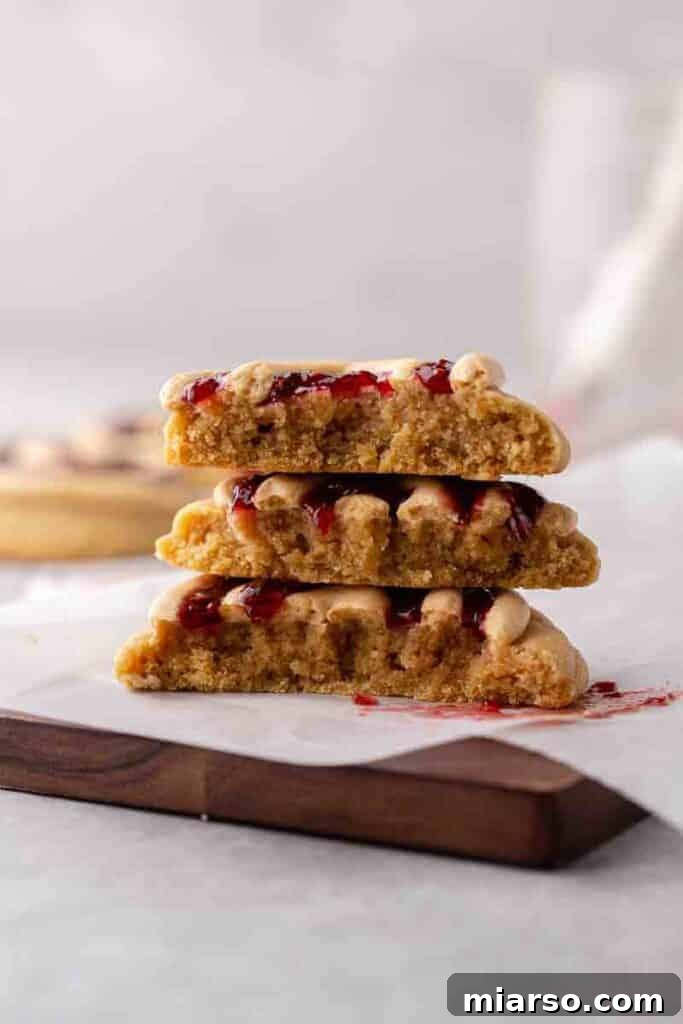 Soft Baked Peanut Butter and Jelly Cookies 12 Stack of freshly baked and frosted CRUMBL peanut butter and jelly cookies.