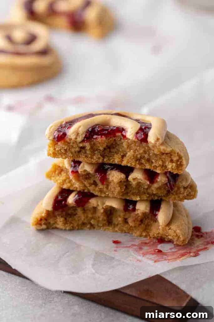 Soft Baked Peanut Butter and Jelly Cookies 3 Close-up of thick peanut butter and jelly cookies with jam swirls.