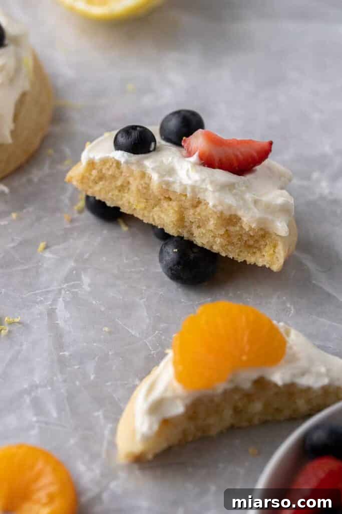 Close up of a fruit pizza cookie broken in half