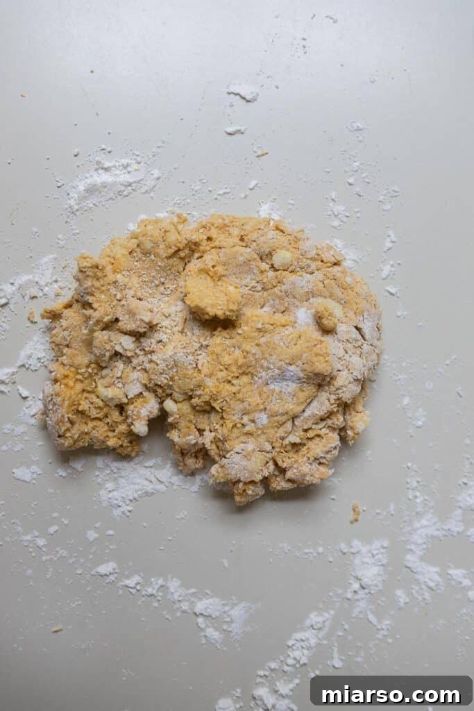 Folding pumpkin biscuit dough for layers