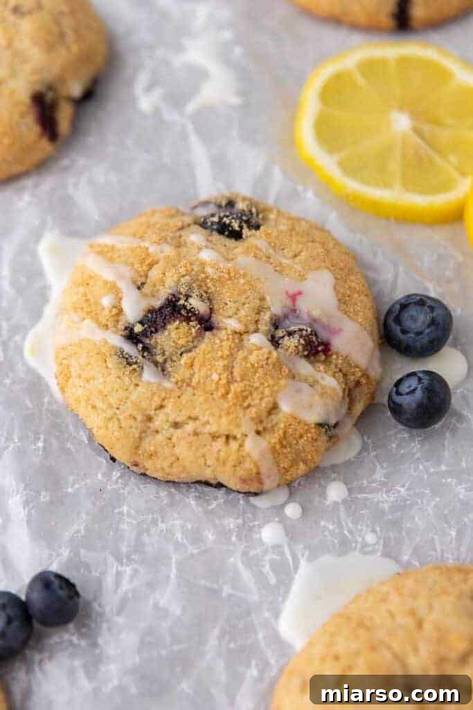 Bakery-Style Soft Blueberry Crumb Cake Cookies 3 Close up of blueberry crumb cake cookies from crumbl