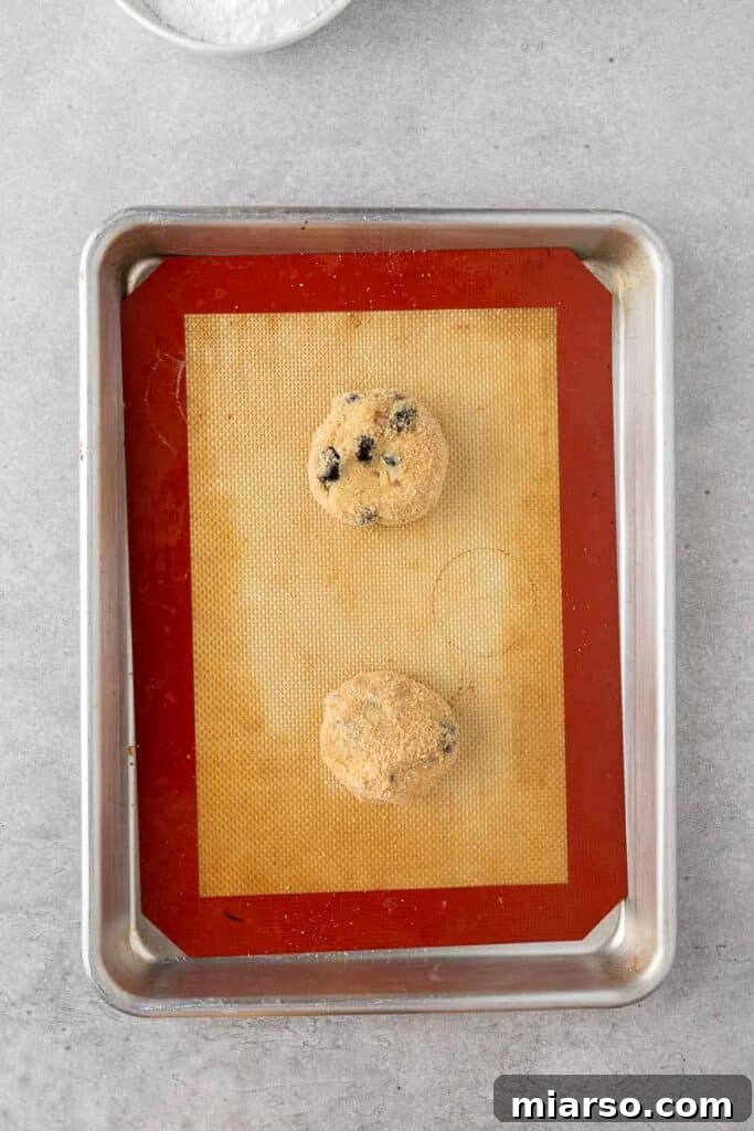 Bakery-Style Soft Blueberry Crumb Cake Cookies 9 Blueberry cookie dough on a baking sheet