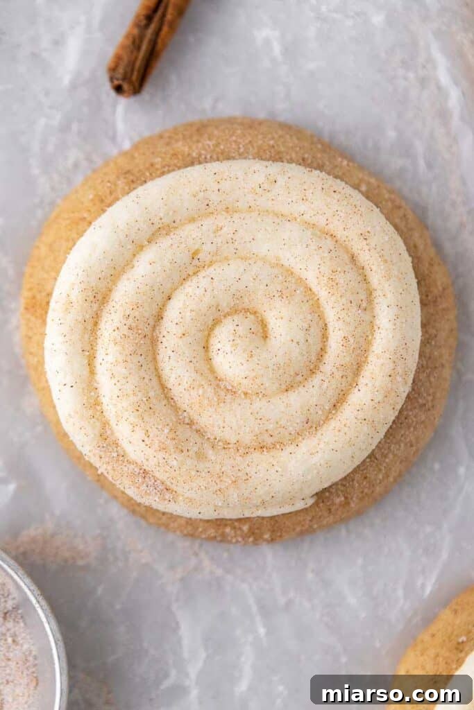 Close-up overhead shot of swirled cream cheese frosting on a Snickerdoodle Cupcake Cookie