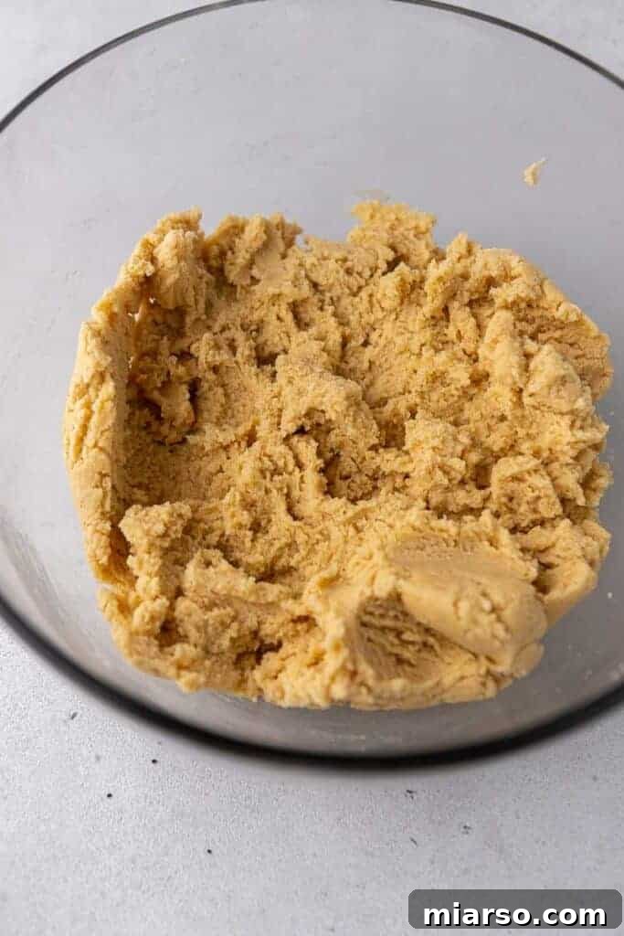 CRUMBL snickerdoodle cookie dough in a bowl