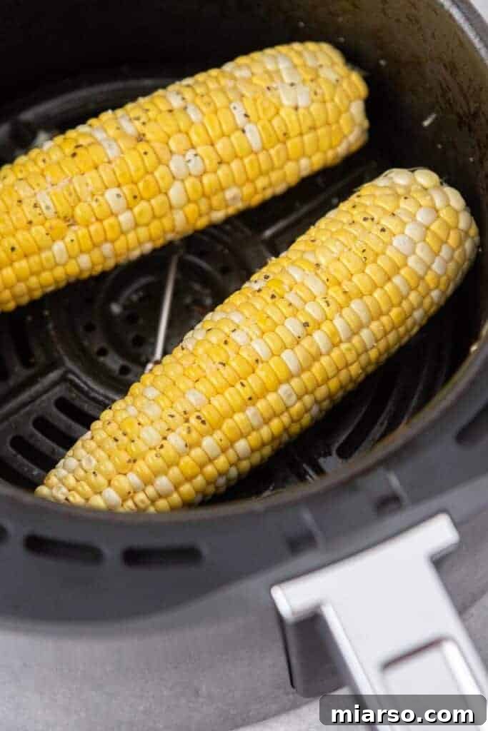 Air Fryer Golden Corn Cobs 5 Seasoning corn on the cob with salt and pepper