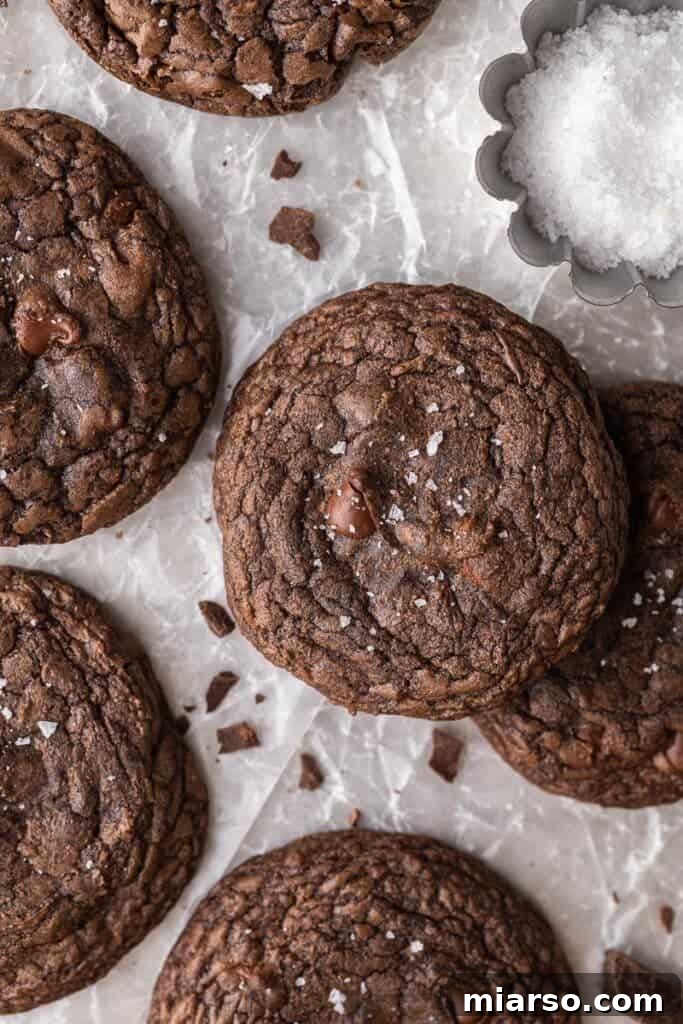 Crumbl's Rich Brownie Batter Indulgence 3 Close-up of freshly baked Crumbl brownie batter cookies on a cooling rack.
