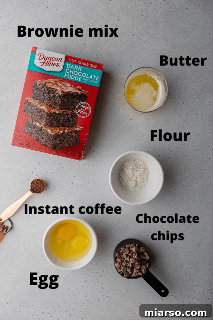 Crumbl's Rich Brownie Batter Indulgence 4 All the essential ingredients for making delicious brownie mix cookies laid out on a kitchen counter.
