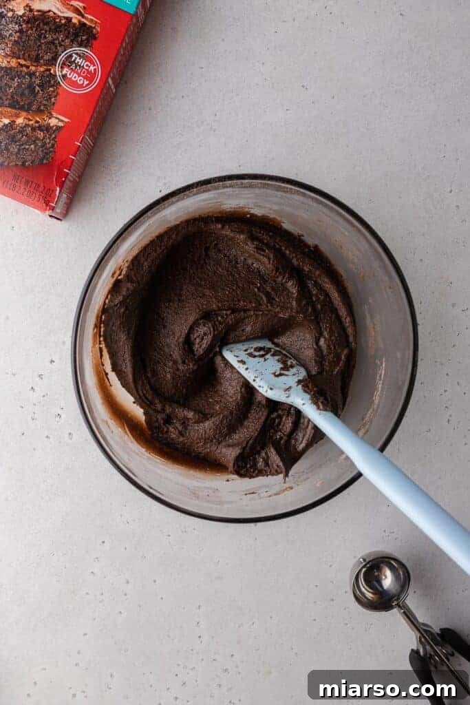 Crumbl's Rich Brownie Batter Indulgence 8 Rich chocolate Crumbl brownie batter cookie dough ready for scooping