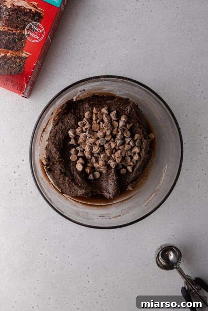 Crumbl's Rich Brownie Batter Indulgence 9 Brownie batter cookie dough with chocolate chips mixed in