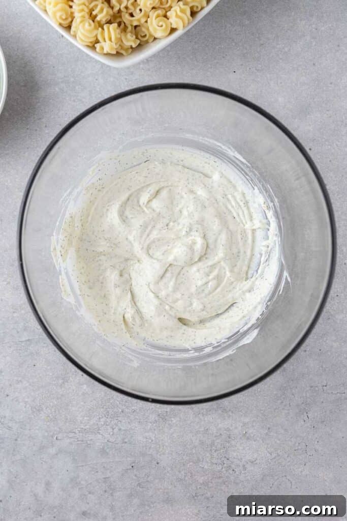 Close-up of creamy dressing in a bowl, ready for mixing