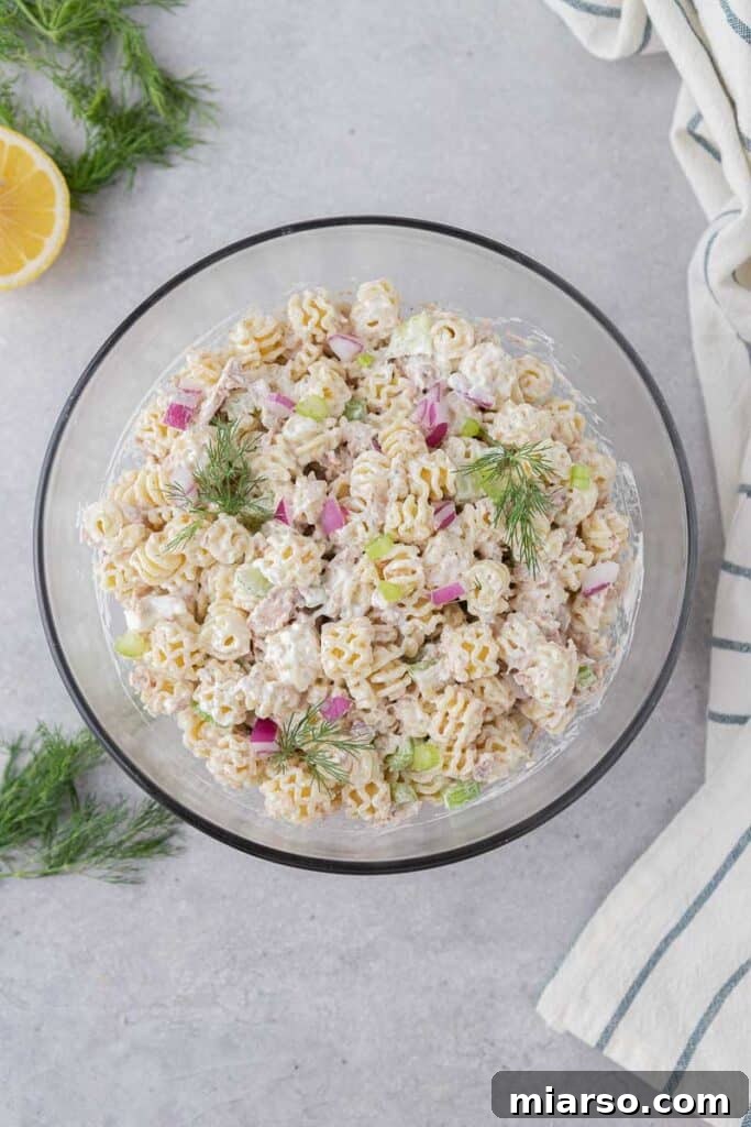 Creamy tuna pasta dish freshly mixed and ready to chill