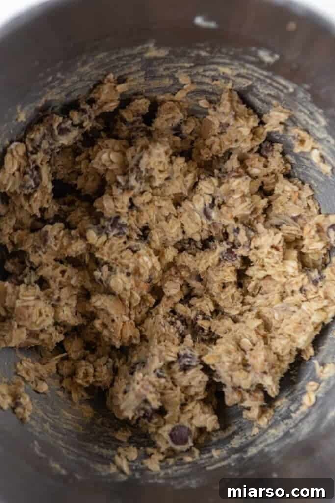 Full bowl of mixed oatmeal cookie dough.
