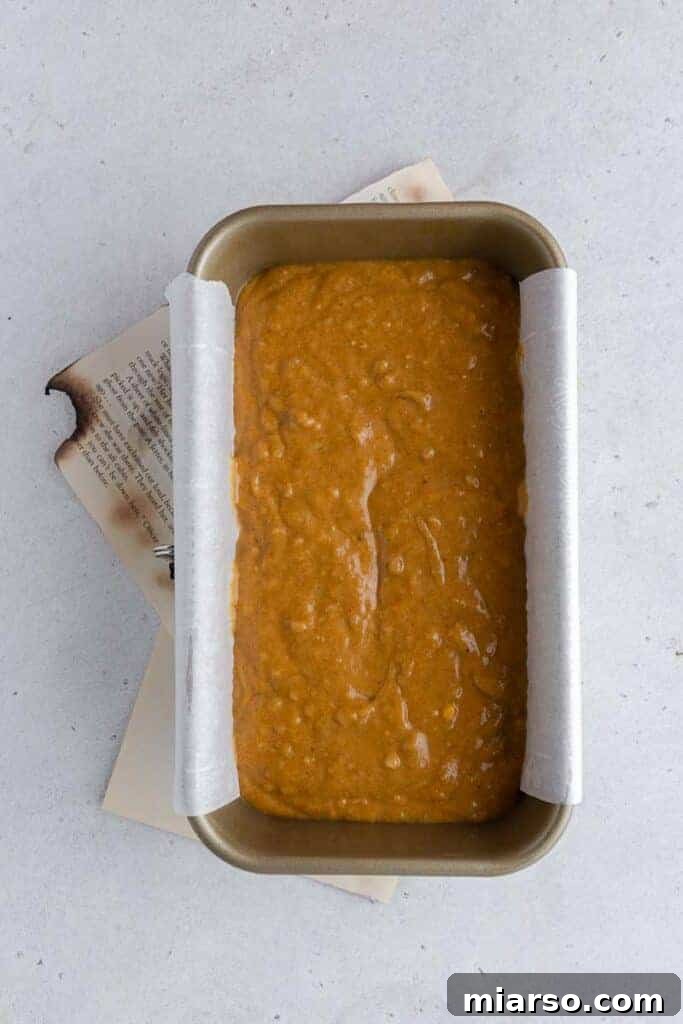 pumpkin banana bread batter in a loaf pan