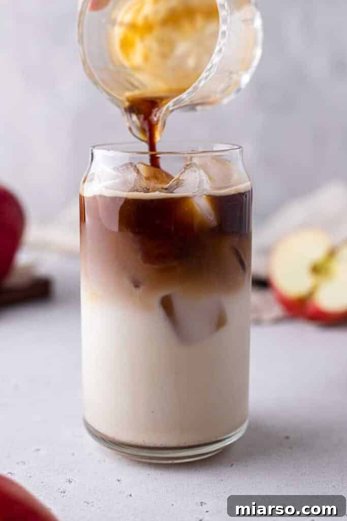 Starbucks Apple Crisp Macchiato 15 Adding espresso to a latte in a glass