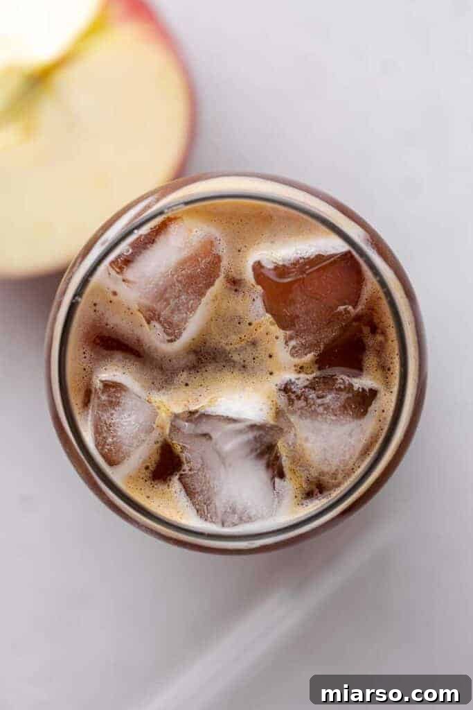 Starbucks Apple Crisp Macchiato 18 Overhead shot of an iced apple macchiato with spices