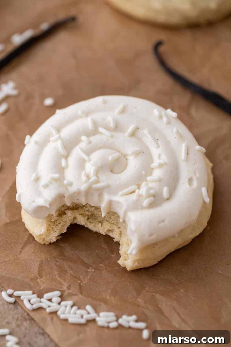 Unlock Crumbl's Secrets: 40+ Copycat Cookie Recipes for 2025 17 Crumbl nilla bean cupcake cookie with a bite taken out of it