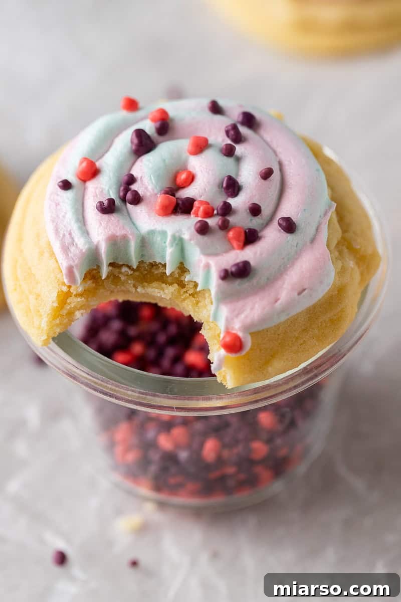 Unlock Crumbl's Secrets: 40+ Copycat Cookie Recipes for 2025 33 Crumbl Cotton candy cookie with a bite taken out of it