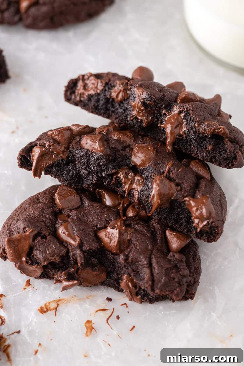 Unlock Crumbl's Secrets: 40+ Copycat Cookie Recipes for 2025 10 Broken double chocolate cookies with gooey melted chocolate centers.