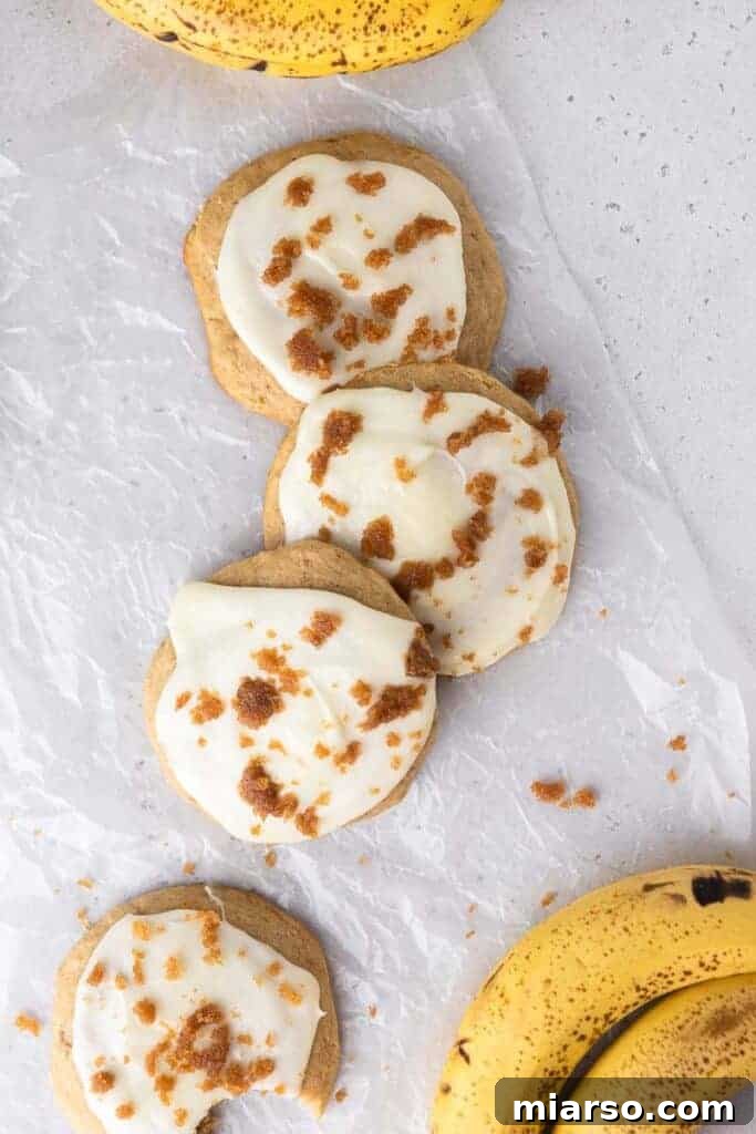 Close-up of a glazed Crumbl banana bread cookie ready to be eaten.
