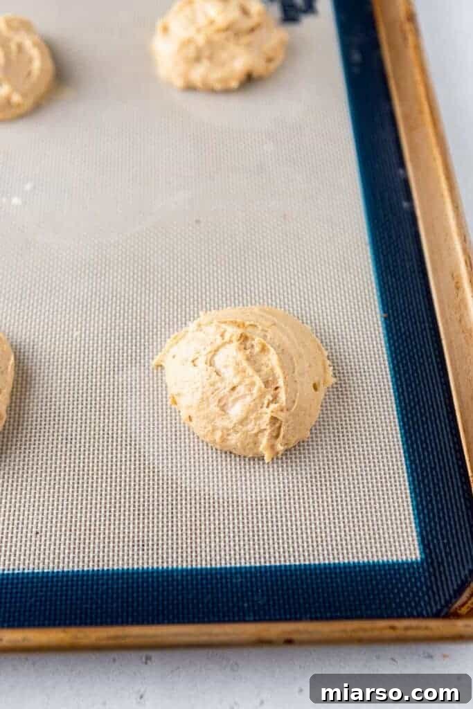 Close-up of Crumbl banana bread cookie dough on a baking sheet