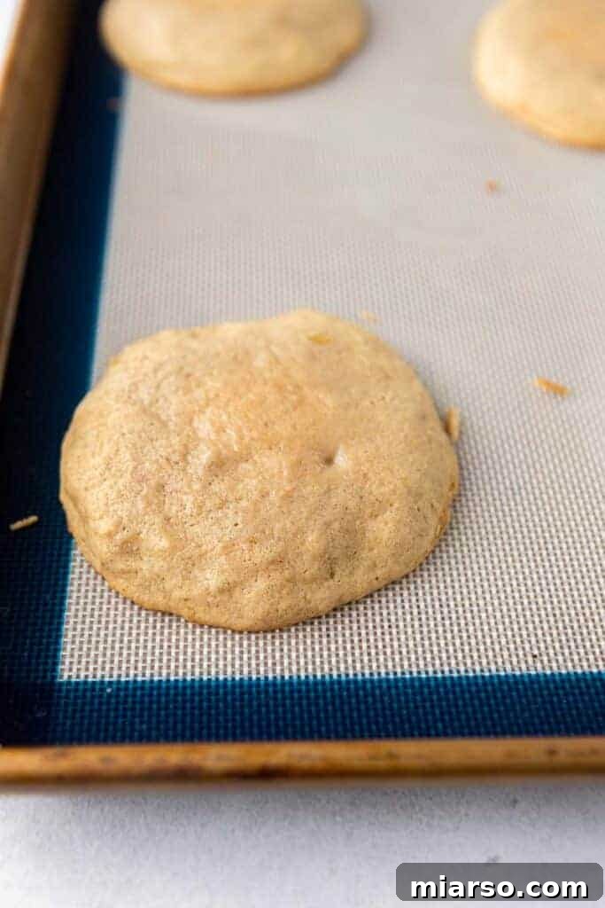 Freshly baked banana bread cookie cooling on a rack
