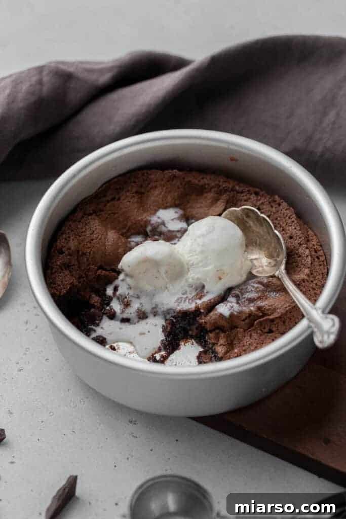 Fudgy Air Fryer Brownies with a scoop of vanilla ice cream