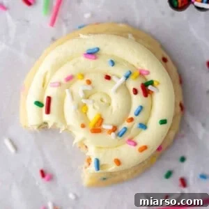 Overhead shot of Crumbl birthday cake cookies, beautifully frosted with sprinkles