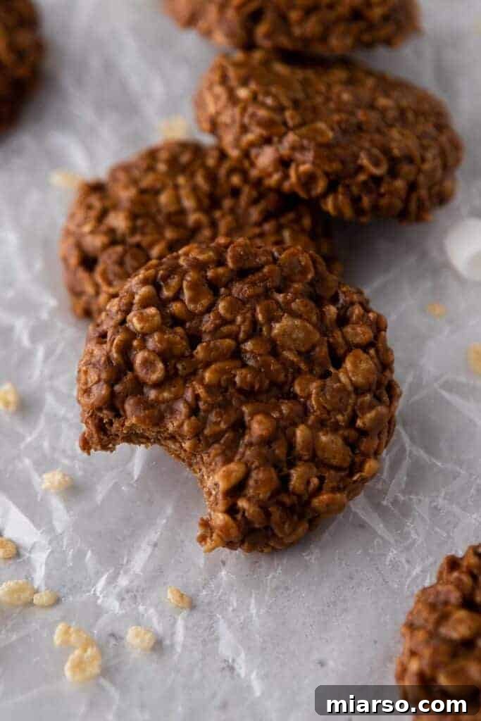 Delicious homemade Crumbl chocolate crunch cookies stacked beautifully.