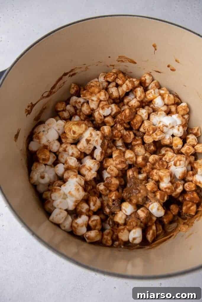 Marshmallows melting in a pot.