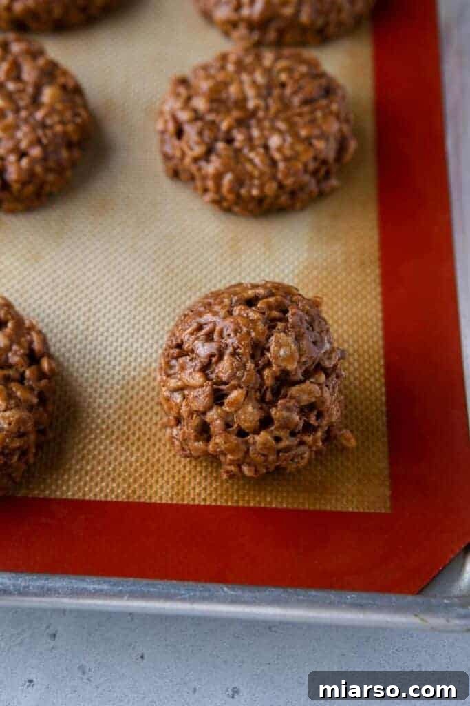 No-bake chocolate cookies shaped on a baking sheet.