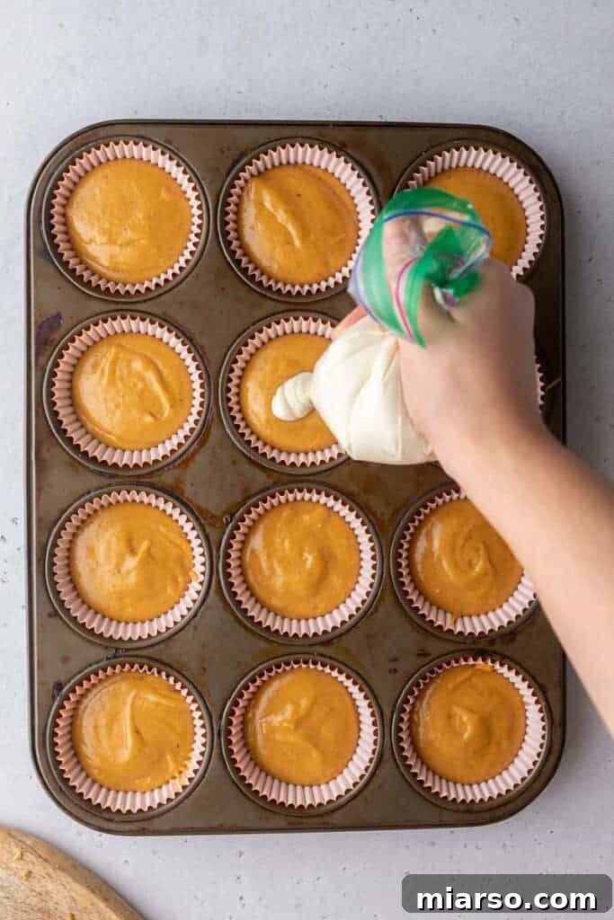 Muffin batter in muffin tin