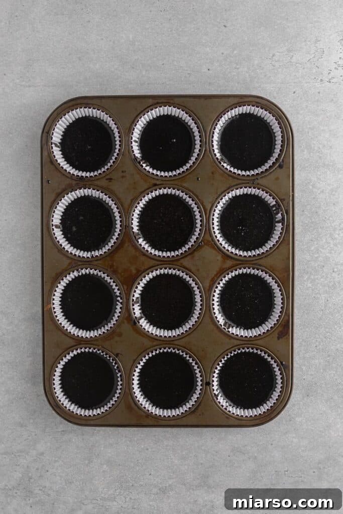 Midnight Velvet Monster Cupcakes 8 black cupcakes in a muffin tin