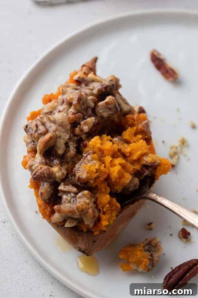Pecan Pie Twice-Baked Sweet Potato Delight 12 Pecan Pie Twice Baked Sweet Potato with a fork in it