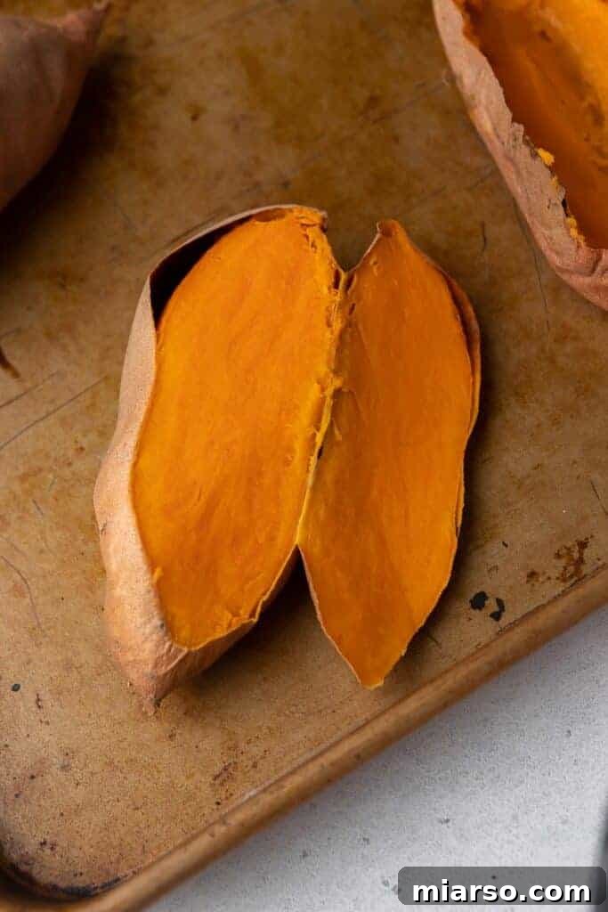 Pecan Pie Twice-Baked Sweet Potato Delight 4 Roasted sweet potato sliced open revealing soft vibrant orange flesh