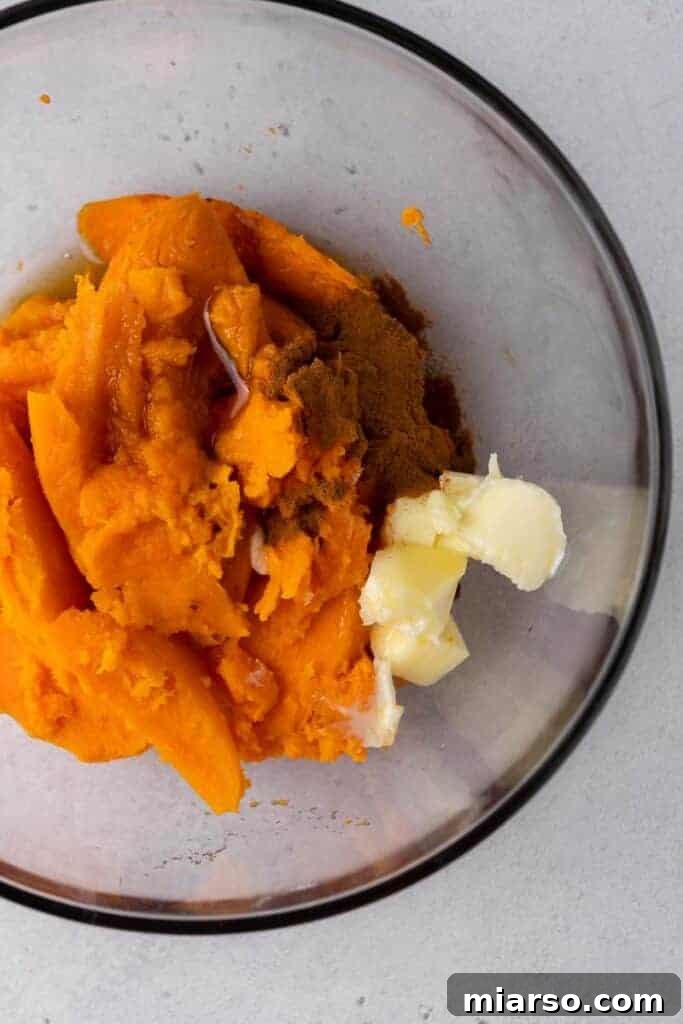 Pecan Pie Twice-Baked Sweet Potato Delight 6 Mash in a bowl with butter cinnamon and maple syrup before mixing