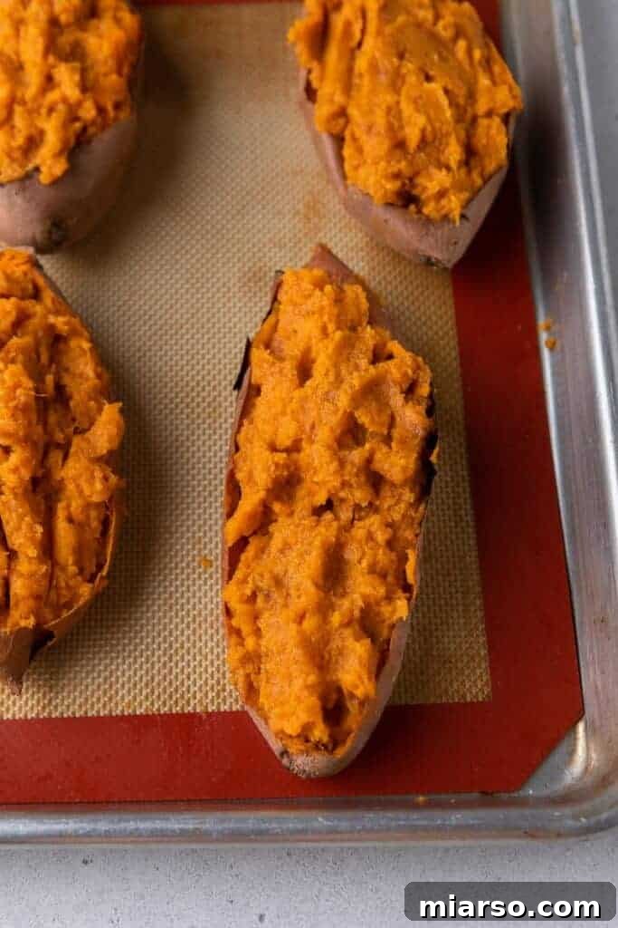 Pecan Pie Twice-Baked Sweet Potato Delight 8 Sweet potatoes filled with seasoned mashed sweet potatoes on baking tray