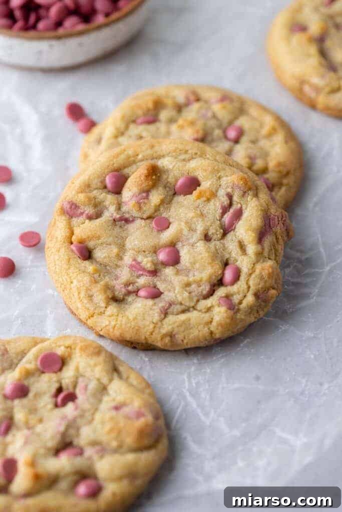 A plate overflowing with giant ruby chocolate chip cookies, showcasing their inviting appearance