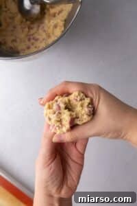 Cookie dough with ruby chocolate chips, showing the jagged-edge method