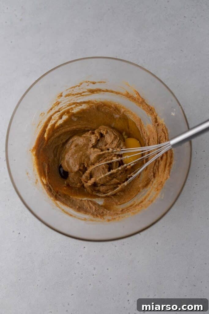 Crumbl's Ultimate Reese's Peanut Butter Cookie 4 Creamed peanut butter and sugar in a bowl